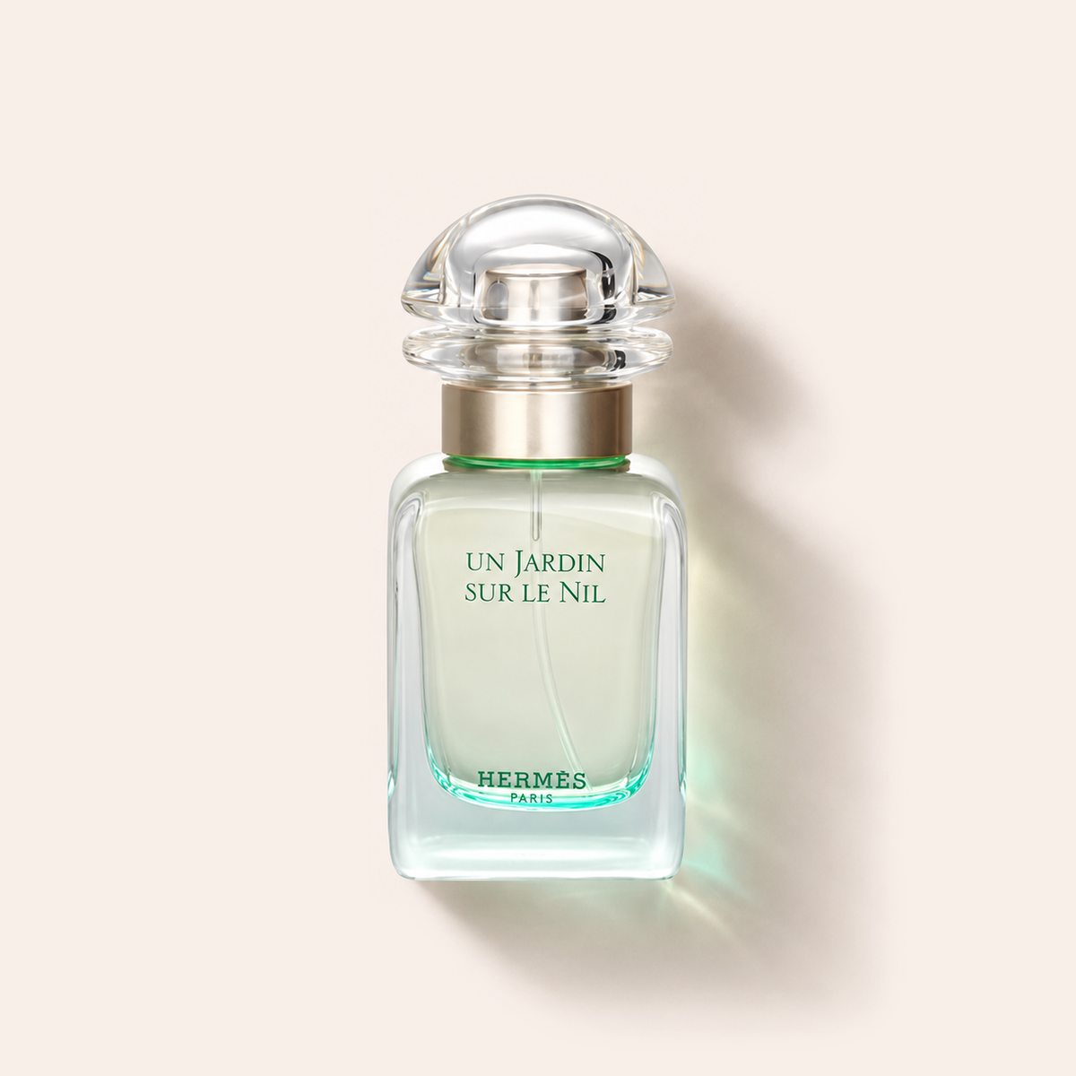 Flakon parfému Hermes Un Jardin Sur Le Nil EDT 30 ml na béžovém pozadí – MrRizz