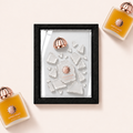 Parfemovy obraz Amouage Overture Woman v cernem ramu - ilustracni fotografie