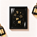 Parfemovy obraz Guerlain Santal Royal v cernem ramu - ilustracni fotografie